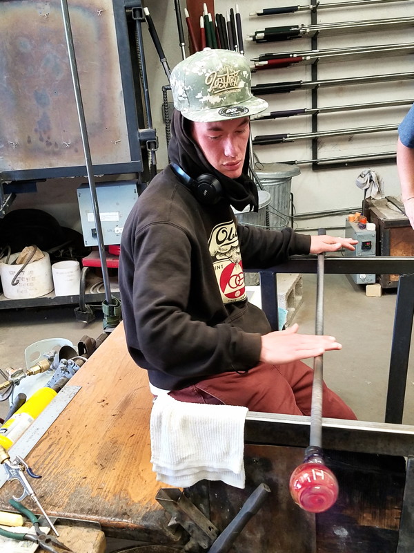 ¡YouthWorks! student learns the art of glass-making at MAKE Santa Fe.