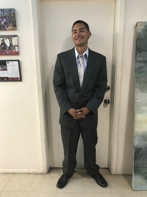 As a result of the clothing drive, Juan is "suited" up.
